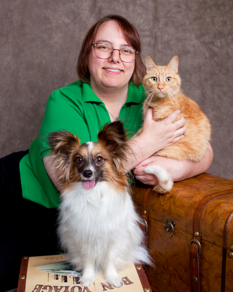 Veterinarian Janet Dornhoff, with her papillon Pippin and her cat Hobbes (photo by Luisa Penepacker)